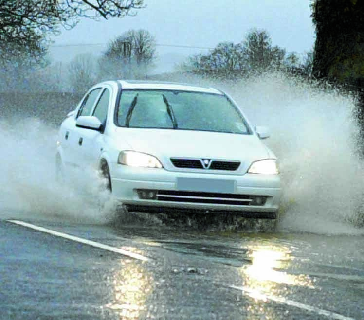 Vehicles stuck on flooded road