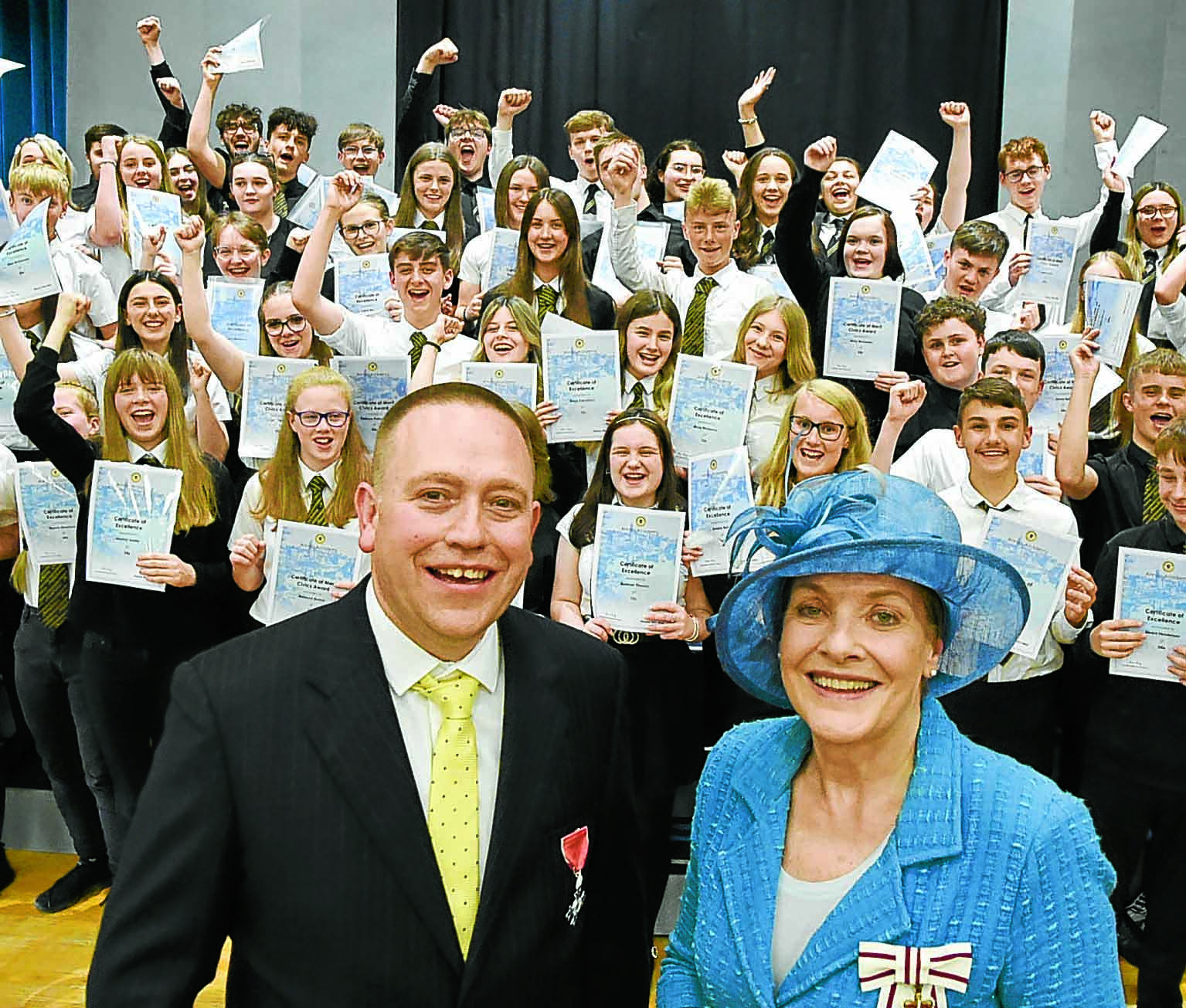 School shares in teacher’s MBE moment