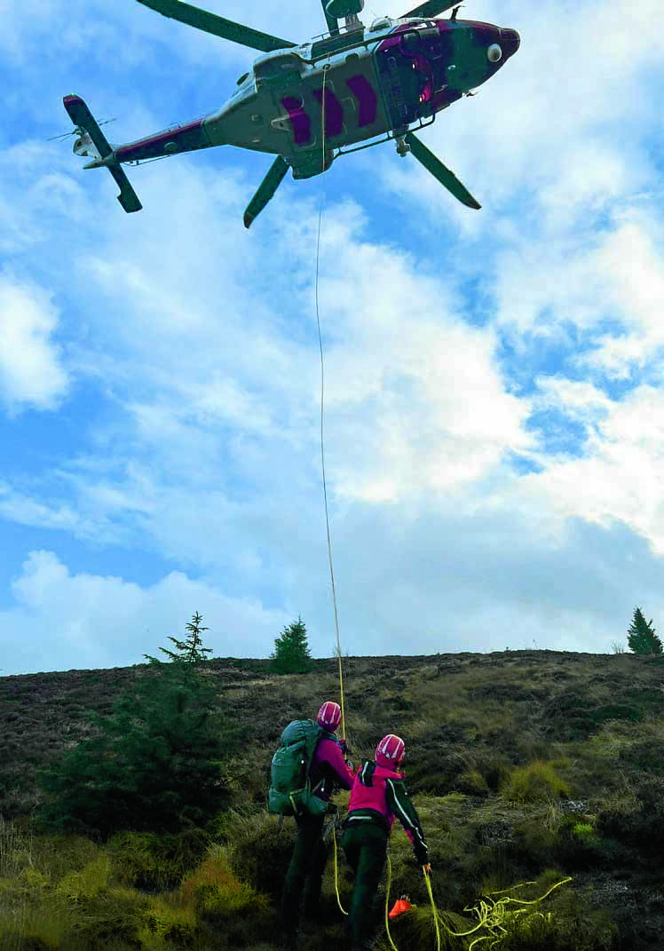 Woman winched off hill