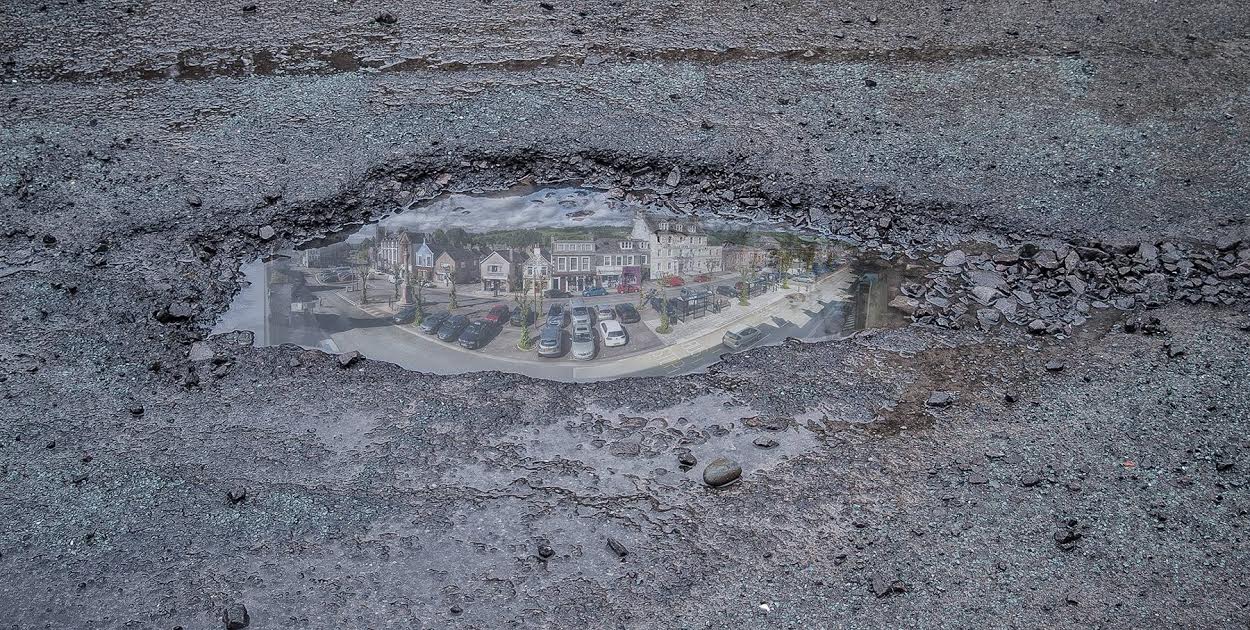 Car written off after pothole accident