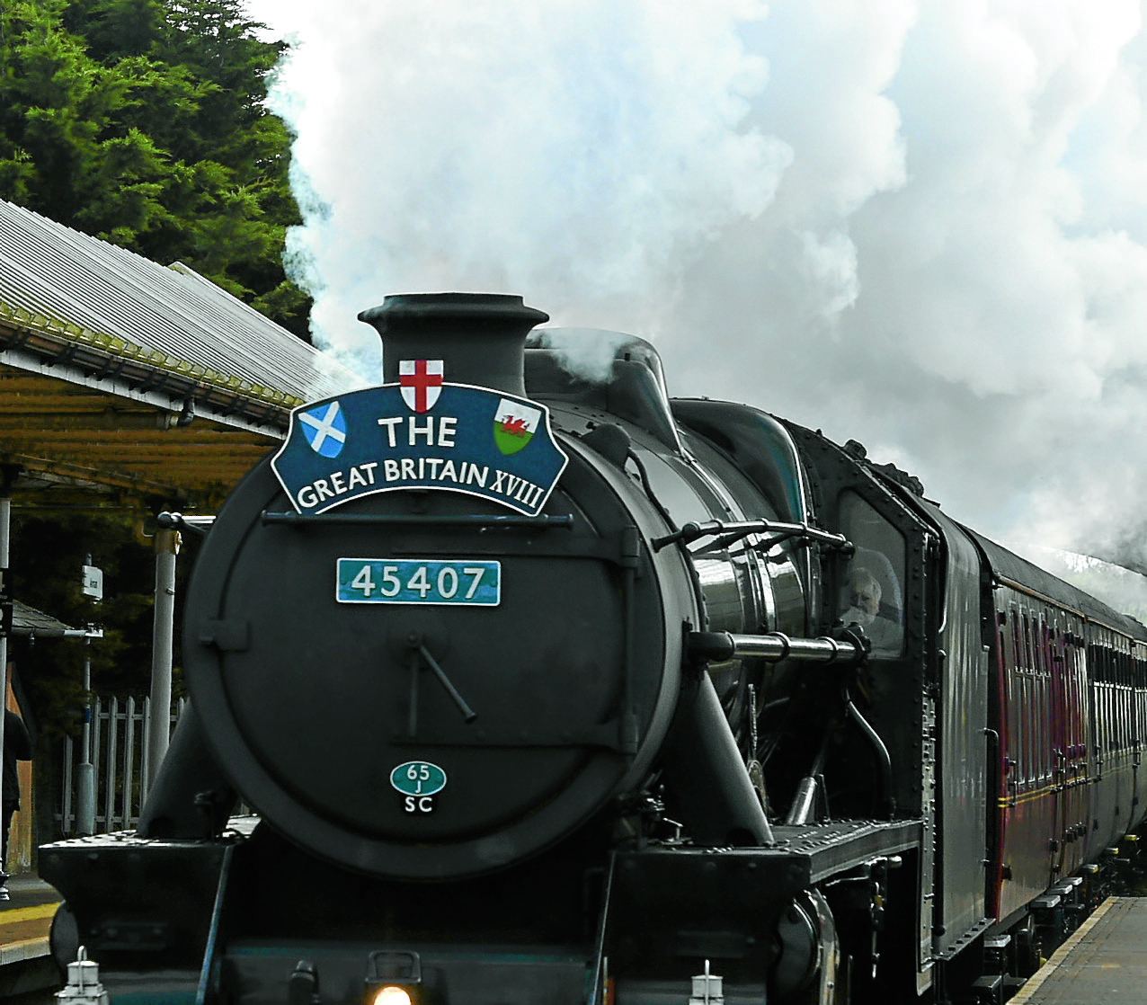Touring steam train passes through
