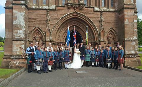 Scout leaders tie the knot . . .with a little help from their troop
